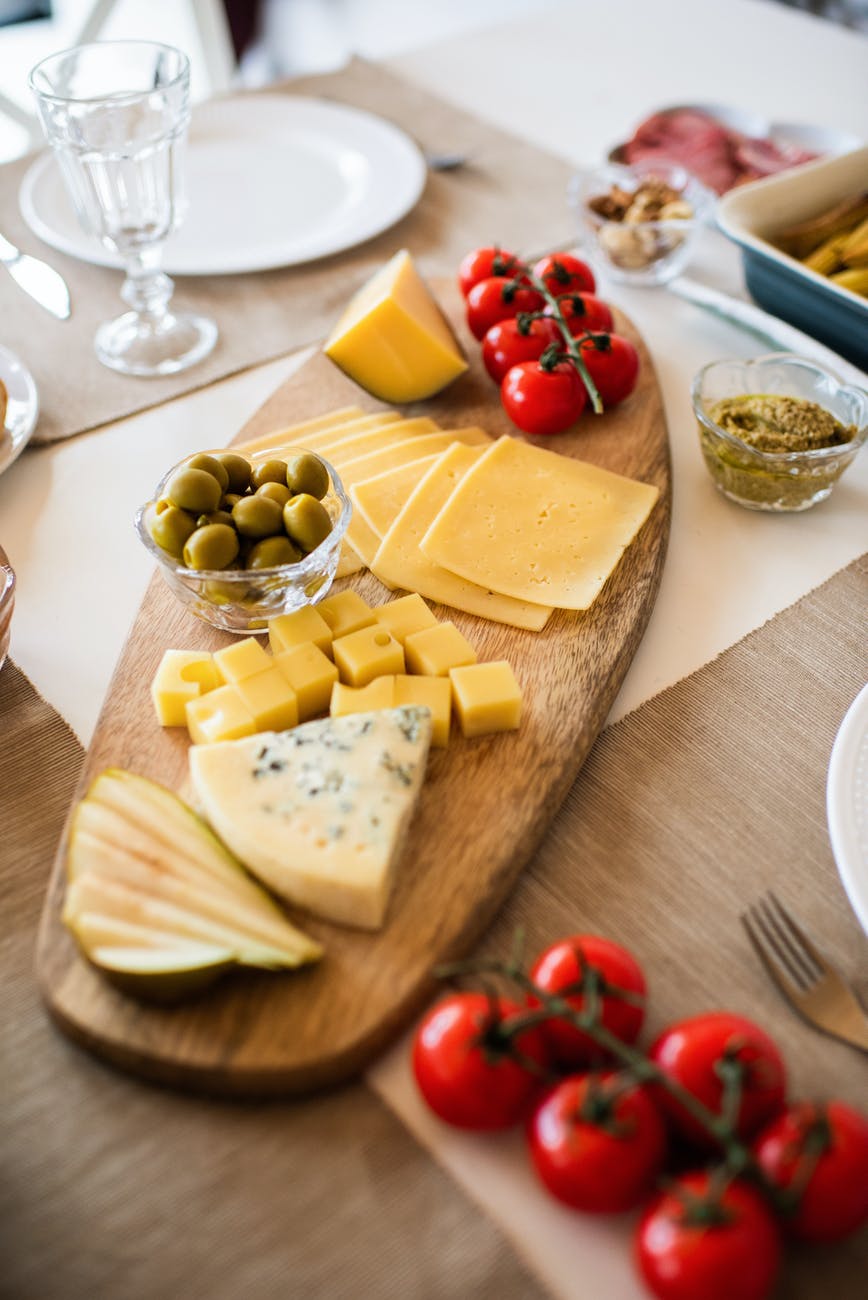 photo of cheese on wooden tray